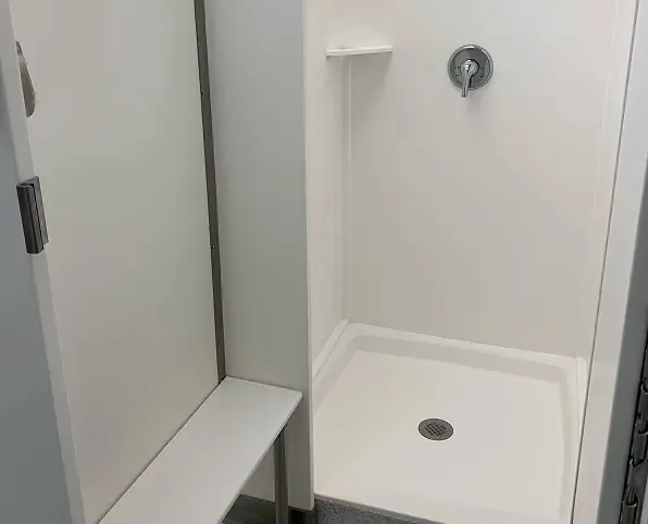 Solid surface shower stall with bench